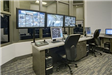 Computer Monitors Line Desks in the Control Room